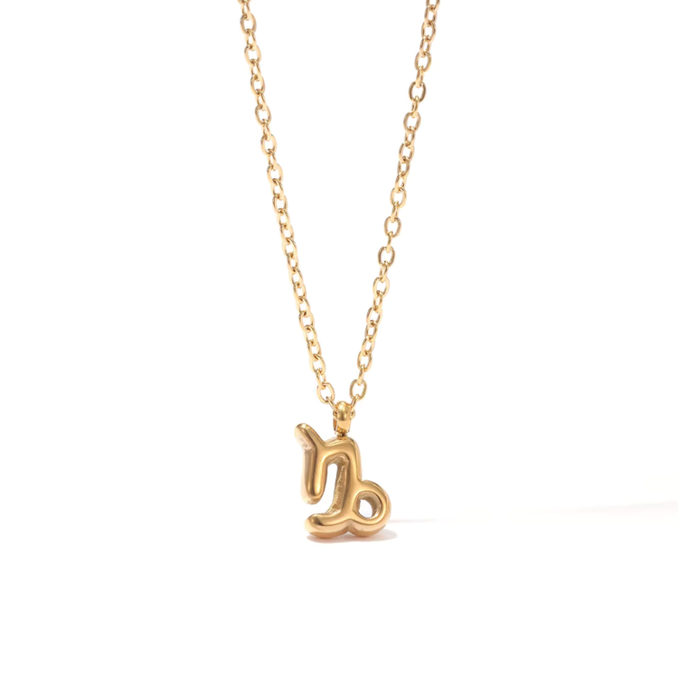 All 12 zodiac symbol bubble necklaces in 18K gold PVD displayed on a stone surface. Bold, chunky glyph pendants on delicate cable chains — waterproof and tarnish-free.