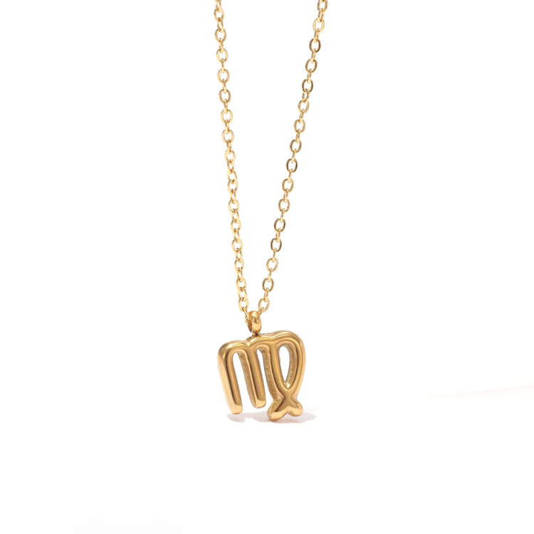 All 12 zodiac symbol bubble necklaces in 18K gold PVD displayed on a stone surface. Bold, chunky glyph pendants on delicate cable chains — waterproof and tarnish-free.